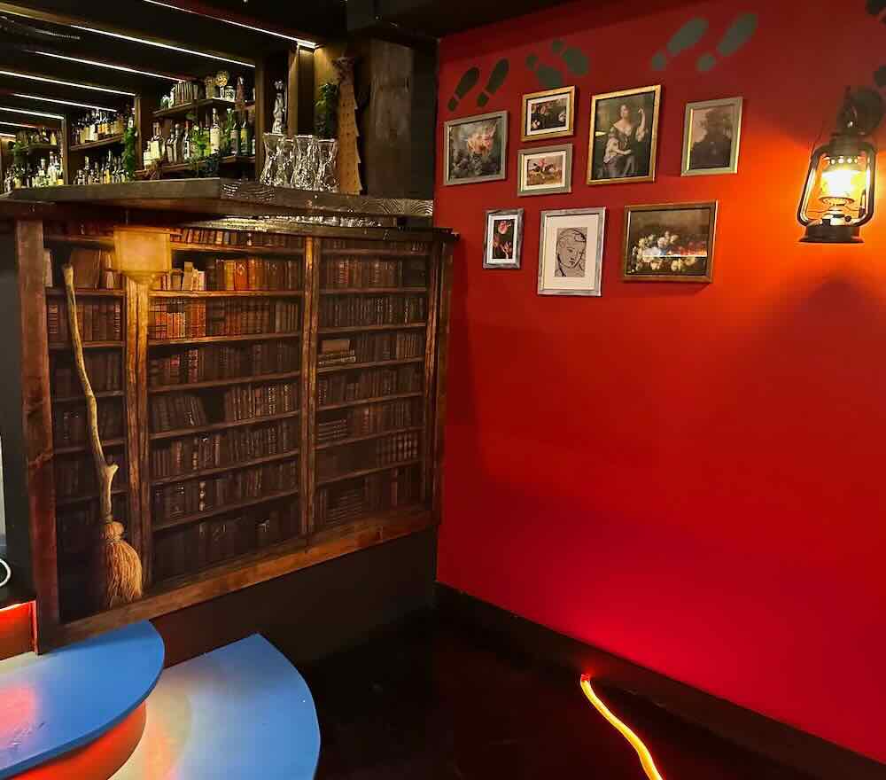 Wizards and Wands Bar Interior - Quidditch Broom and Bookcase